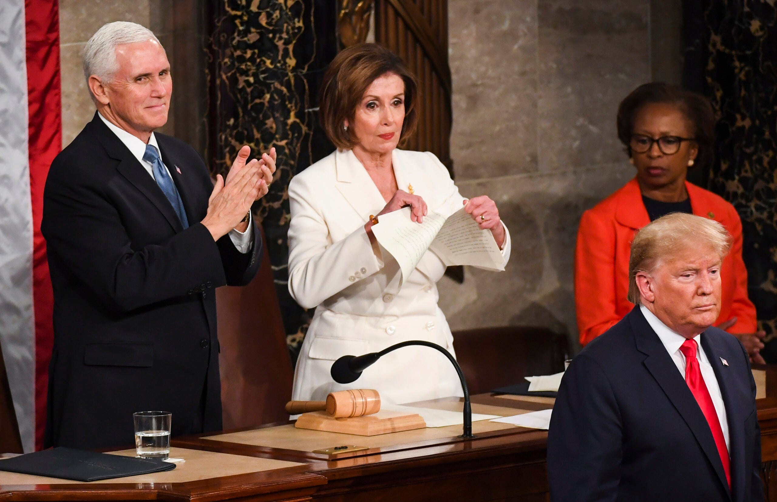 House Speaker Nancy Pelosi (D-California) tears up her copy of President Donald Trump's State of the Union address after he delivered it in February 2020.