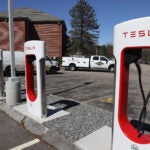 Three Tesla vehicles were damaged at a Dedham dealership overnight, police said.