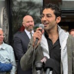 Mohsen Mahdawi speaks outside the courthouse.