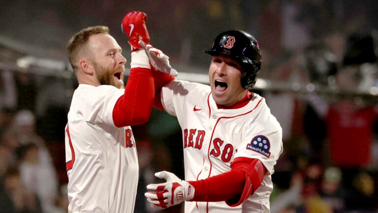 Boston Red Sox's Trevor Story, left, and Alex Bregman, right, celebrate Bregman's three-run homer in the third inning during the second baseball game of a doubleheader against the St. Louis Cardinals, Sunday, April 6, 2025, in Boston.