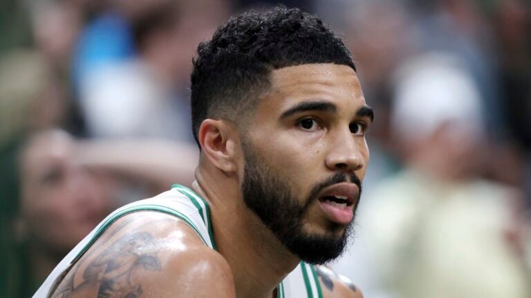 Boston Celtics' Jayson Tatum on the bench during the second half in game 1 of a first-round NBA playoff basketball series against the Orlando Magic Sunday, April 20, 2025, in Boston.