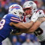 New England Patriots guard Cole Strange (69) blocks Buffalo Bills linebacker Matt Milano (58) during the first half of an NFL football game Sunday, Jan. 8, 2023, in Orchard Park, N.Y.