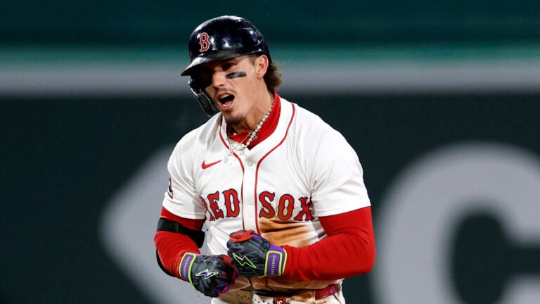 Red Sox outfielder Jarren Duran (16) reacts to hitting a double during the third inning at Fenway Park.