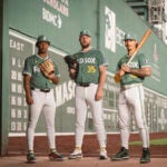 Brayan Bello #66 of the Boston Red Sox, Garrett Crochet #35 of the Boston Red Sox, and Jarren Duran #16 of the Boston Red Sox pose for portraits outside the Green Monster wearing the new City Connect jerseys in Boston, Massachusetts.