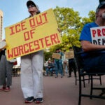 Jeanne Kissane, left, joined a rally outside city hall in Worcester on May 13.