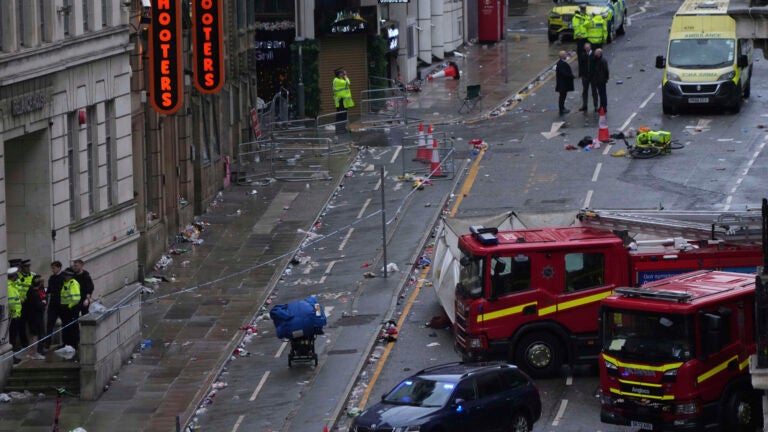 Driver arrested after his minivan plows through soccer fans celebrating in Liverpool
