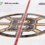 The Boston Bruins logo is seen at center ice at TD Garden during the third period of an NHL hockey game between the Boston Bruins and the Colorado Avalanche Monday, Feb. 21, 2022, in Boston.