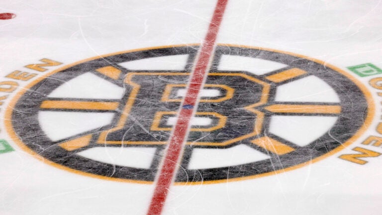 The Boston Bruins logo is seen at center ice at TD Garden during the third period of an NHL hockey game between the Boston Bruins and the Colorado Avalanche Monday, Feb. 21, 2022, in Boston.