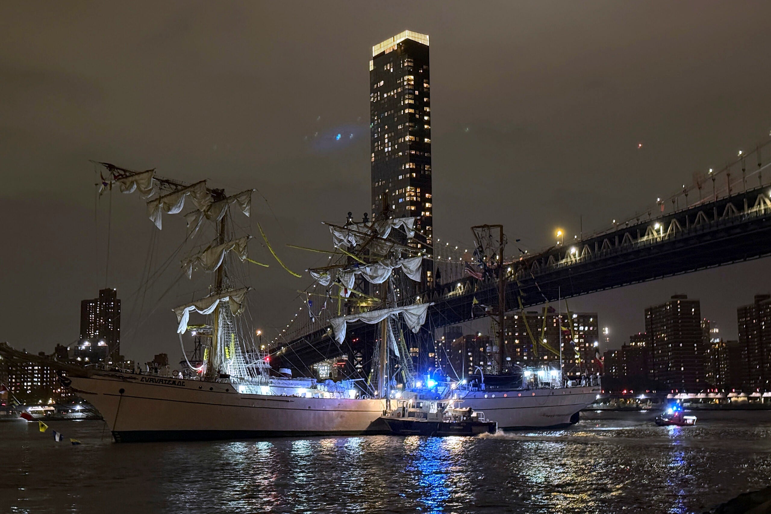 Tall ship strikes Brooklyn Bridge, snapping masts and killing 2 crew