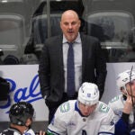 Vancouver Canucks head coach Rick Tocchet in the first period of an NHL hockey game Thursday, April 10, 2025, in Denver.