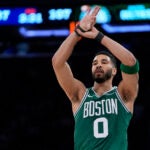 Boston Celtics' Jayson Tatum reacts after scoring a 3-point basket during the second half of Game 3 of an NBA basketball second-round playoff series against the New York Knicks, Saturday, May 10, 2025, in New York.