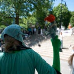 "Lady Liberty" listens to a speech.