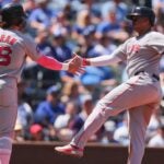 Rafael Devers celebrates with Jarren Duran after hitting a two run home run during the sixth inning at Kauffman Stadium on May 11, 2025 in Kansas City, Missouri.