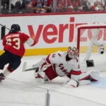 Florida Panthers' Brad Marchand reacts after scoring a goal against Carolina Hurricanes goaltender Pyotr Kochetkov.