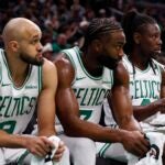 Boston Celtics' Derrick White (9), Jaylen Brown (7) and Jrue Holiday (4) during the second half of an NBA basketball game against the Sacramento Kings Friday, Jan. 10, 2025, in Boston.