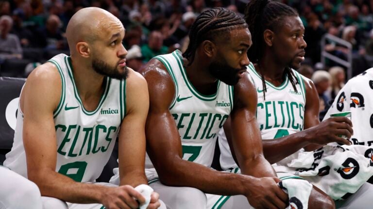 Boston Celtics' Derrick White (9), Jaylen Brown (7) and Jrue Holiday (4) during the second half of an NBA basketball game against the Sacramento Kings Friday, Jan. 10, 2025, in Boston.