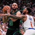 Celtics guard Derrick White drives to the basket against Knicks guard Cameron Payne during the first half of Game 5.