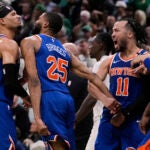 New York Knicks celebrate after defeating the Boston Celtics in Game 1 of an NBA basketball second-round playoff series Monday, May 5, 2025, in Boston.