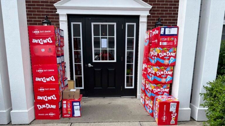 This image provided by Holly LaFavers shows boxes of Dum-Dum lollipops outside of her home Monday, May 5, 2025, in Lexington, Ky.
