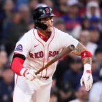 Red Sox outfielder Jarren Duran watches the flight of his drive during the fourth inning