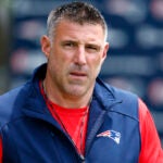 New England Patriots head coach Mike Vrabel walks onto the field for the OTA offseason workouts at Gillette Stadium on May 28, 2025.