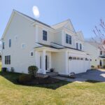 The unit for sale is on the left, and comes with a two-car garage.
