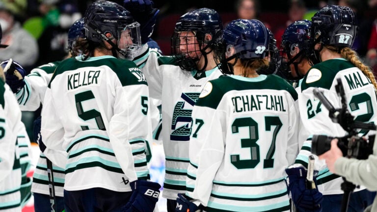 Boston Fleet's Hilary Knight (21) celebrates the win with Megan Keller (5) during the third period of a PWHL hockey game against the Ottawa Charge in Ottawa, Ont., Saturday, March 15, 2025.
