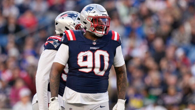 New England Patriots defensive tackle Christian Barmore (90) heads to the line of scrimmage against the Los Angeles Rams during the second half of an NFL football game, Sunday, Nov. 17, 2024, in Foxborough, Mass.