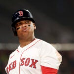 Boston Red Sox designated hitter Rafael Devers reacts after striking out during the eighth inning of a baseball game against the Texas Rangers, Tuesday, May 6, 2025, in Boston.