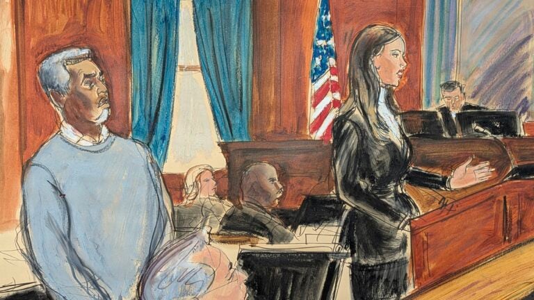 Sean Diddy Combs, left, stands as his defense attorney, Teny Geragos, gives her opening statement.
