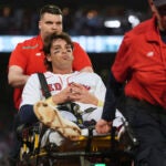 Boston Red Sox's Triston Casas is transported off the field on a stretcher after an apparent injury during the second inning of a baseball game against the Minnesota Twins at Fenway Park, Friday, May 2, 2025, in Boston.