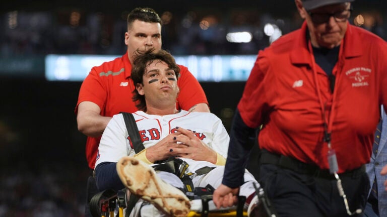 Boston Red Sox's Triston Casas is transported off the field on a stretcher after an apparent injury during the second inning of a baseball game against the Minnesota Twins at Fenway Park, Friday, May 2, 2025, in Boston.