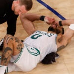 Medical staff check out Boston Celtics forward Jayson Tatum (0) during the fourth quarter in game four of the NBA Eastern Conference semifinal against the New York Knicks at Madison Square Garden.