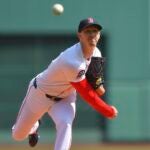 Boston Red Sox's Walker Buehler delivers a pitch to a Chicago White Sox batter in the first inning of a baseball game, Monday, April 21, 2025, in Boston.