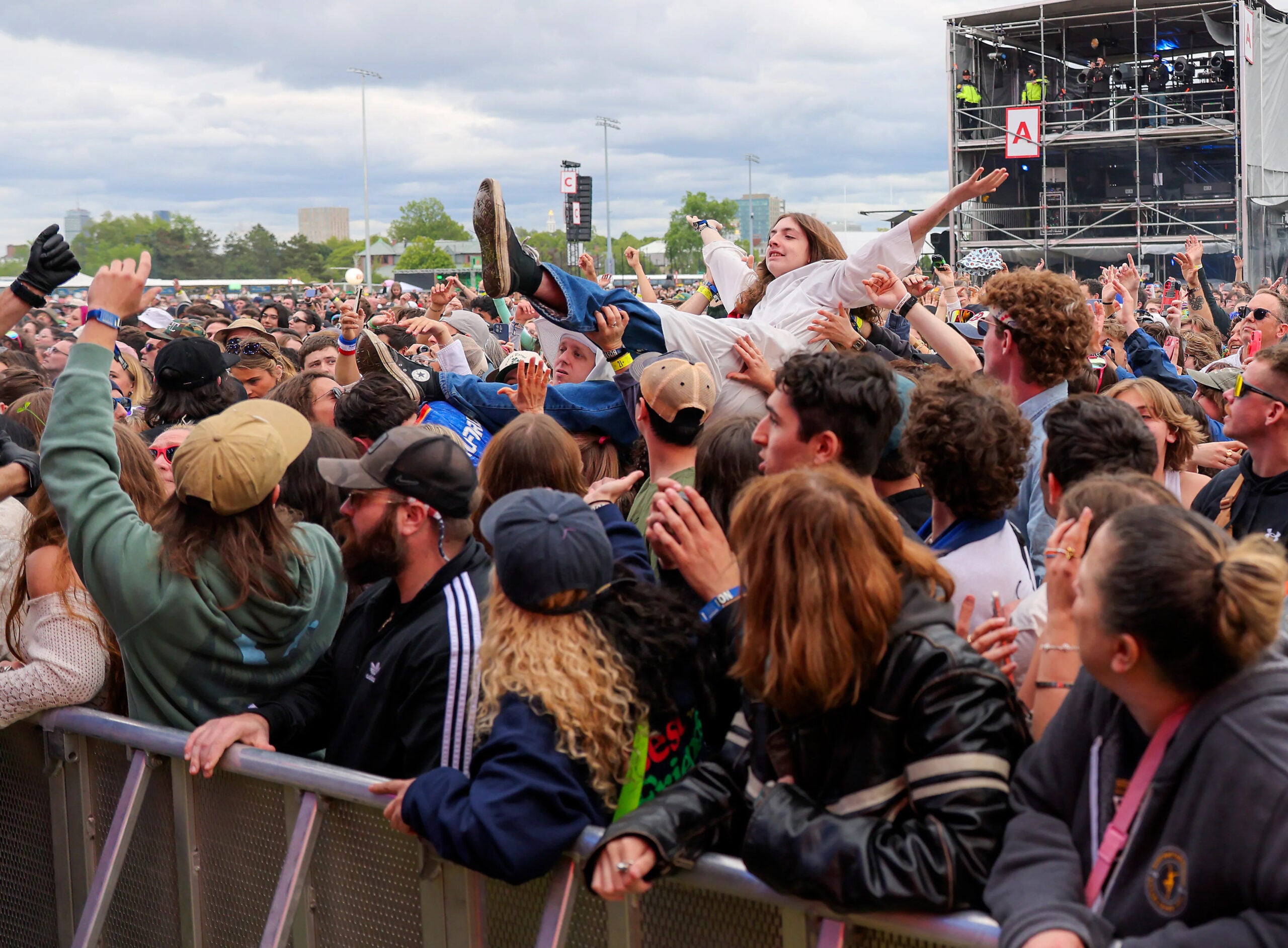 A fan crowd surfs while Sublime performs on the Green Stage during Boston Calling on May 25, 2025.