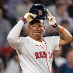 Boston Red Sox third base Rafael Devers (11) reacts after not being able to advance to home because of a foul ball during the eighth inning at Fenway Park on Wednesday, April 23, 2025.