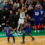Boston Celtics forward Jayson Tatum (0) throws up a missed three pointer during the fourth quarter in game one of the NBA Eastern Conference semifinal against the New York Knicks at TD Garden.