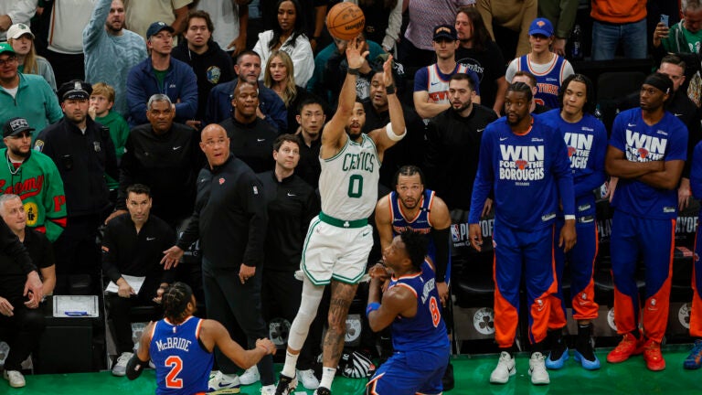 Boston Celtics forward Jayson Tatum (0) throws up a missed three pointer during the fourth quarter in game one of the NBA Eastern Conference semifinal against the New York Knicks at TD Garden.