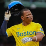 Rafael Devers #11 of the Boston Red Sox reacts after a line drive out to end the inning against the Minnesota Twins during fifth inning MLB action at Fenway Park in Boston MA on May 3 2025.