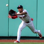 Ceddanne Rafaela #3 of the Boston Red Sox catching sinking line drive for the final out hit by Josh Smith #8 of the Texas Rangers during ninth inning MLB action at Fenway Park on May 8, 2025.