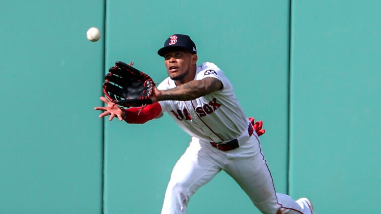 Ceddanne Rafaela #3 of the Boston Red Sox catching sinking line drive for the final out hit by Josh Smith #8 of the Texas Rangers during ninth inning MLB action at Fenway Park on May 8, 2025.