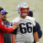 The NE Patriots held a mini rookie camp at the Gillette Stadium bubble. Will Campbell gets some intructions from a coaching staff.