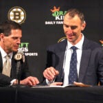 Zdeno Chara held a press conference at TD Garden to announce his retirement after he signed a one-day contract with the team to retire form the Bruins and the NHL. Don Sweeney(left) hands him the contract to sign.