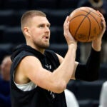 Boston Celtics center Kristaps Porzingis shoots during warmups before game five of the NBA Eastern Conference semifinal against the New York Knicks at TD Garden.