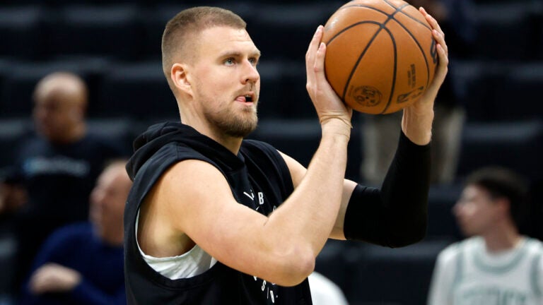 Boston Celtics center Kristaps Porzingis shoots during warmups before game five of the NBA Eastern Conference semifinal against the New York Knicks at TD Garden.