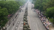 Military parade rolls through DC as 'No Kings' protesters across US decry Trump