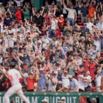 Fans rejoice after a walk off home run by Boston Red Sox's Ceddanne Rafaela (3) in the ninth inning of a baseball game against the Los Angeles Angels, Wednesday June 4, 2025, in Boston.