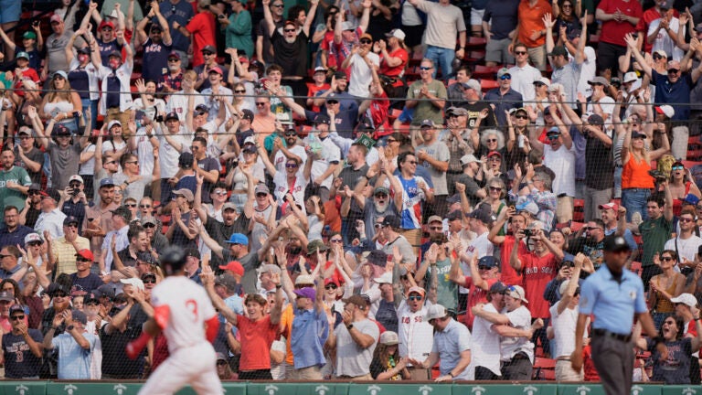 Fans rejoice after a walk off home run by Boston Red Sox's Ceddanne Rafaela (3) in the ninth inning of a baseball game against the Los Angeles Angels, Wednesday June 4, 2025, in Boston.