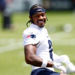New England Patriots wide receiver Stefon Diggs participates in team stretches during the OTA offseason workouts at Gillette Stadium on June 2, 2025.