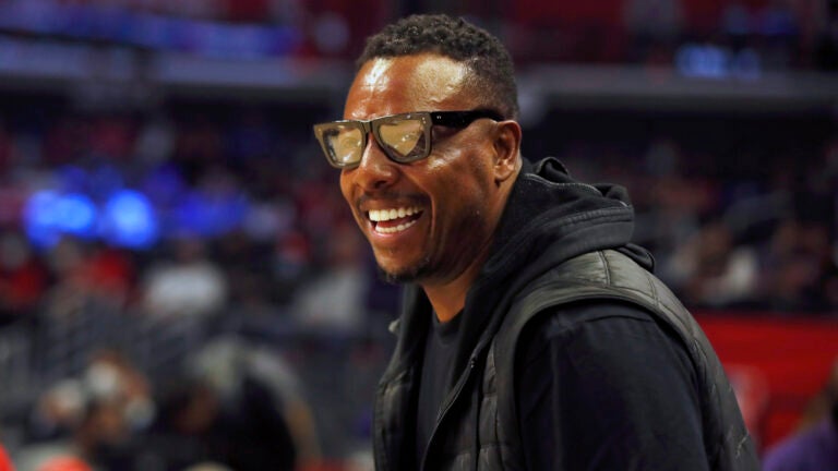 Former NBA basketball player Paul Pierce smiles watching warmups before an NBA basketball game between the Los Angeles Clippers and the Chicago Bulls, Nov. 14, 2021, in Los Angeles.